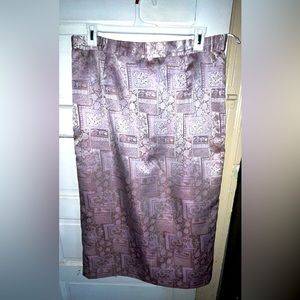This is a (Thrifted) Justin Taylor skirt! It’s a purple print skirt size 16w.